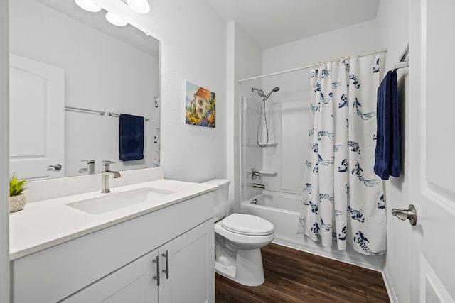 full bathroom featuring vanity, toilet, hardwood / wood-style floors, and shower / bath combo with shower curtain