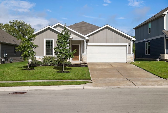 view of front of home with a garage and a front lawn