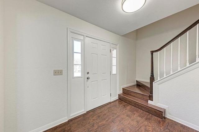 foyer entrance with dark hardwood / wood-style flooring