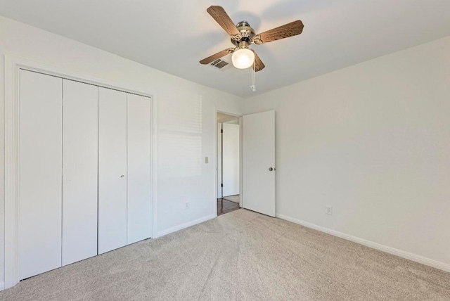 11202 Holster Ct, Austin, TX 78748 - unfurnished bedroom with light colored carpet, a closet, and ceiling fan