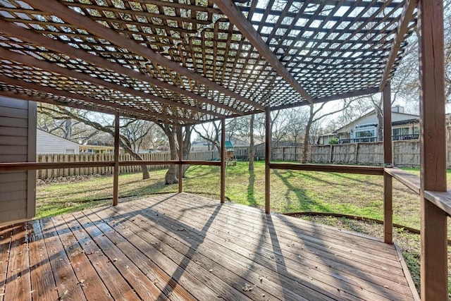 wooden deck featuring a pergola and a lawn