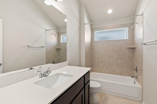 full bathroom with tiled shower / bath, vanity, toilet, and tile patterned flooring