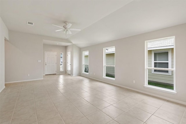 tiled empty room featuring ceiling fan