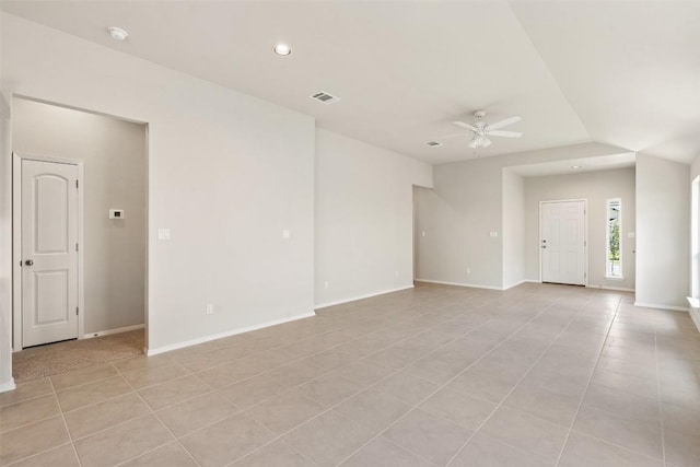 spare room with light tile patterned floors and ceiling fan