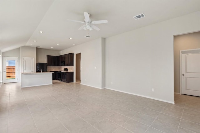 unfurnished living room with vaulted ceiling, light tile patterned floors, and ceiling fan