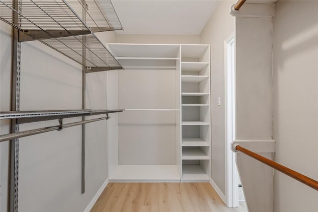 spacious closet featuring light wood-type flooring