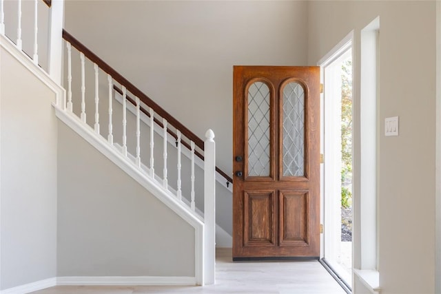 foyer entrance with light hardwood / wood-style flooring