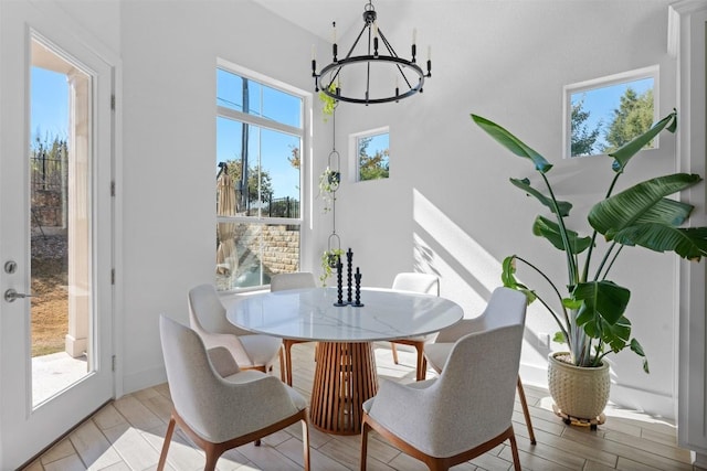 dining space featuring a chandelier and light hardwood / wood-style floors