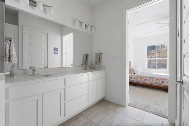 bathroom with tile patterned flooring and vanity