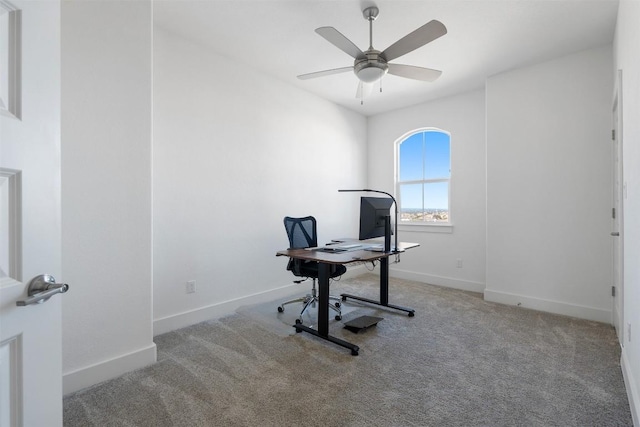 carpeted home office with ceiling fan