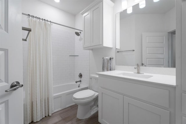 full bathroom featuring shower / tub combo with curtain, wood-type flooring, toilet, and vanity