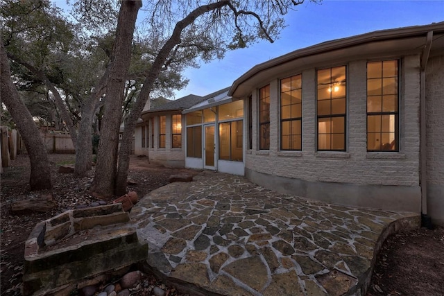 view of side of property with a patio area