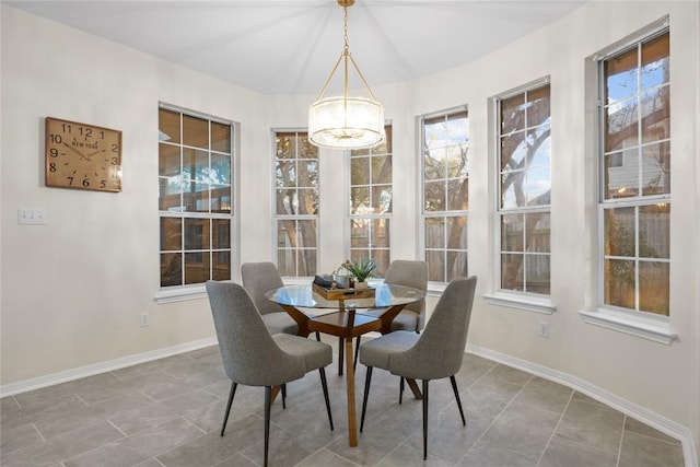 dining space featuring an inviting chandelier