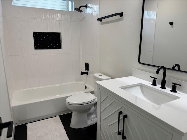 full bathroom with vanity, tiled shower / bath combo, and toilet