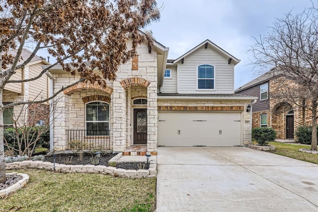 view of front facade featuring an attached garage, stone siding, concrete driveway, and roof with shingles