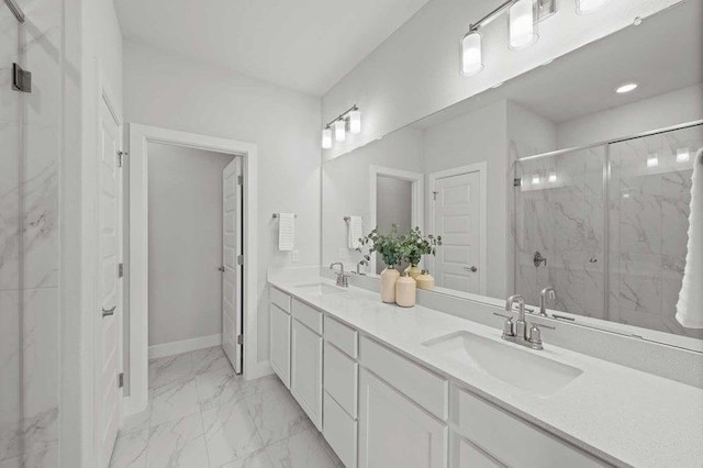 bathroom with walk in shower and vanity