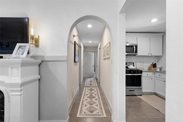5410 Overbrook Dr, Austin, TX 78723 - corridor featuring arched walkways, recessed lighting, and light tile patterned floors