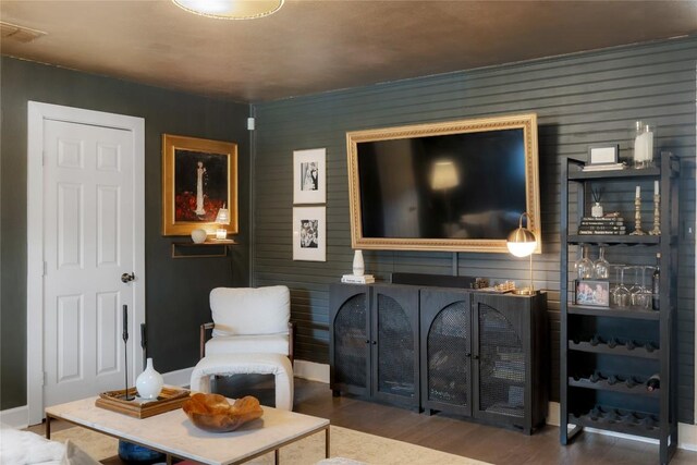 5410 Overbrook Dr, Austin, TX 78723 - living room featuring wood finished floors and wood walls