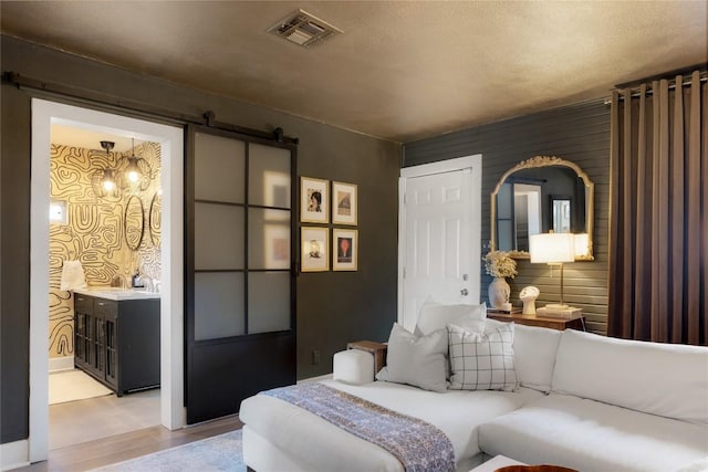 5410 Overbrook Dr, Austin, TX 78723 - living room with light wood-style floors and a barn door