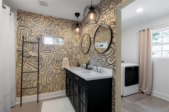 5410 Overbrook Dr, Austin, TX 78723 - full bath featuring washer / clothes dryer, wallpapered walls, and double vanity