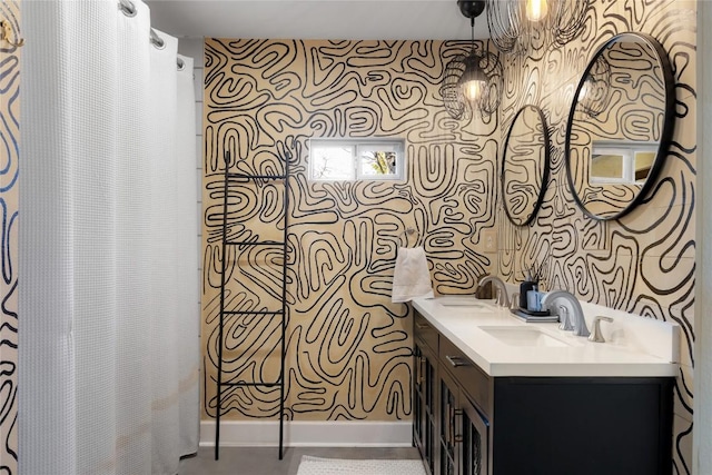5410 Overbrook Dr, Austin, TX 78723 - bathroom featuring wallpapered walls, double vanity, and a shower with shower curtain