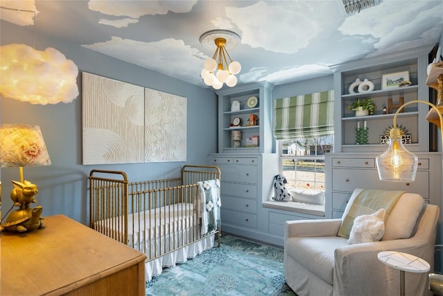 5410 Overbrook Dr, Austin, TX 78723 - bedroom with a chandelier, a crib, and wood finished floors