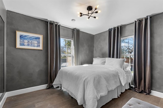 5410 Overbrook Dr, Austin, TX 78723 - bedroom featuring a chandelier, multiple windows, and wood finished floors