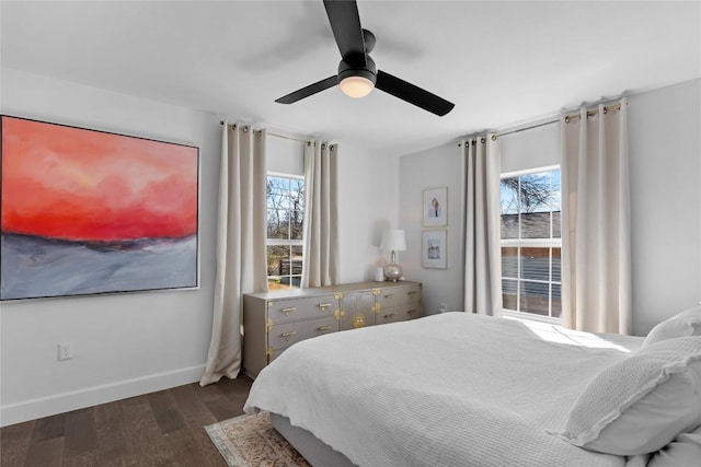 5410 Overbrook Dr, Austin, TX 78723 - bedroom featuring multiple windows, dark wood-style flooring, and a ceiling fan