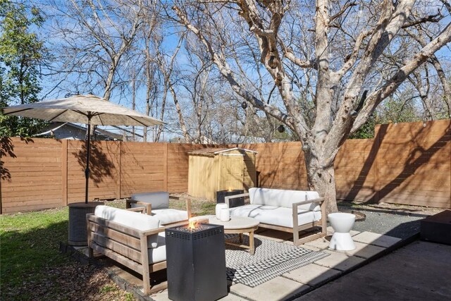 5410 Overbrook Dr, Austin, TX 78723 - fenced backyard featuring an outdoor living space with a fire pit and a patio area
