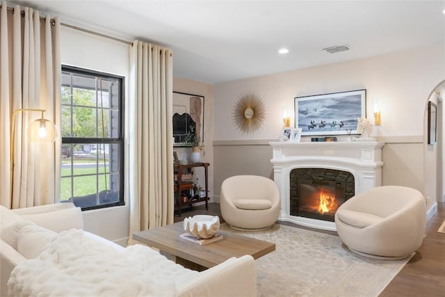 5410 Overbrook Dr, Austin, TX 78723 - living area featuring a glass covered fireplace, wood finished floors, and recessed lighting