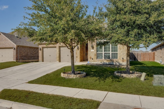 view of front of property with a garage and a front yard