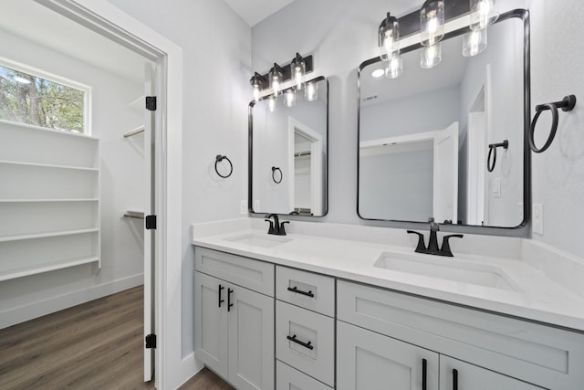 bathroom with vanity and hardwood / wood-style floors