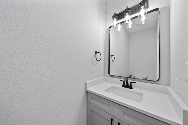 106 Halawa Ct, Bastrop, TX 78602 - bathroom with vanity and a textured wall