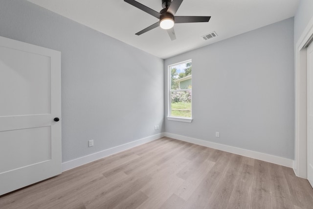 unfurnished bedroom with ceiling fan and light wood-type flooring