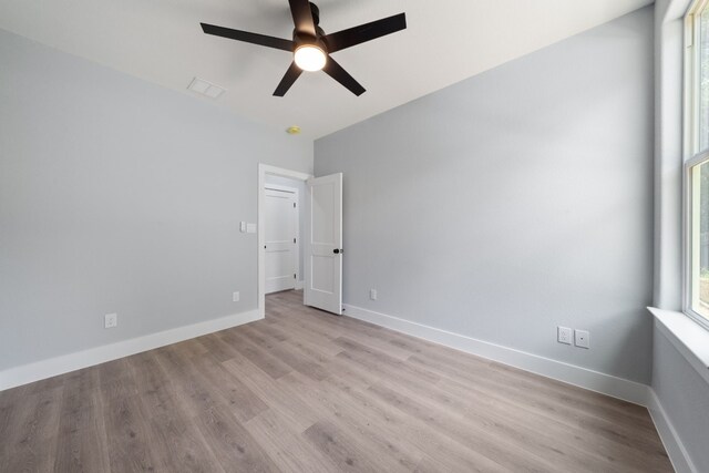 unfurnished room featuring ceiling fan and light hardwood / wood-style flooring