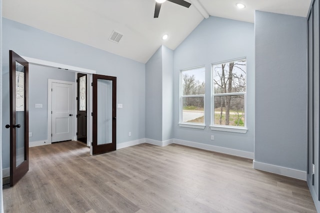 106 Halawa Ct, Bastrop, TX 78602 - unfurnished bedroom featuring lofted ceiling, light wood-style floors, a ceiling fan, french doors, and recessed lighting