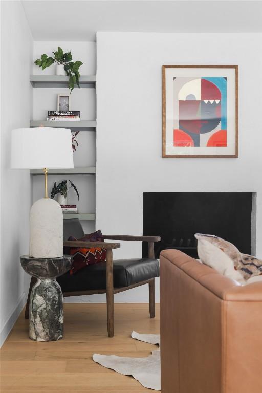 sitting room with hardwood / wood-style flooring