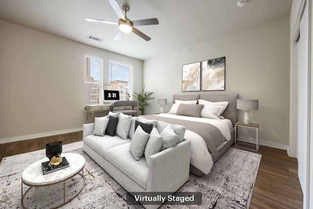 bedroom with dark wood-type flooring and ceiling fan