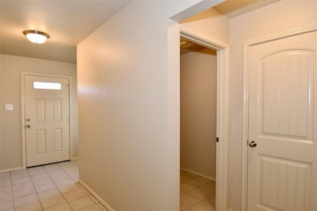 hall with light tile patterned flooring