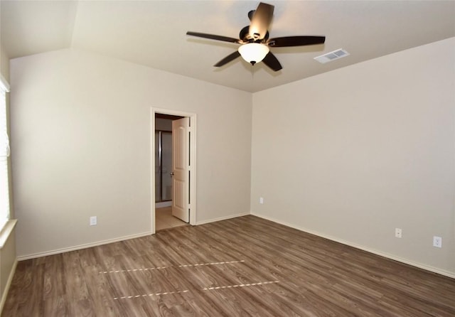 empty room featuring hardwood / wood-style floors and ceiling fan