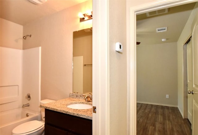 full bathroom featuring shower / tub combination, vanity, toilet, and wood-type flooring