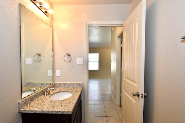 bathroom with tile patterned flooring and vanity