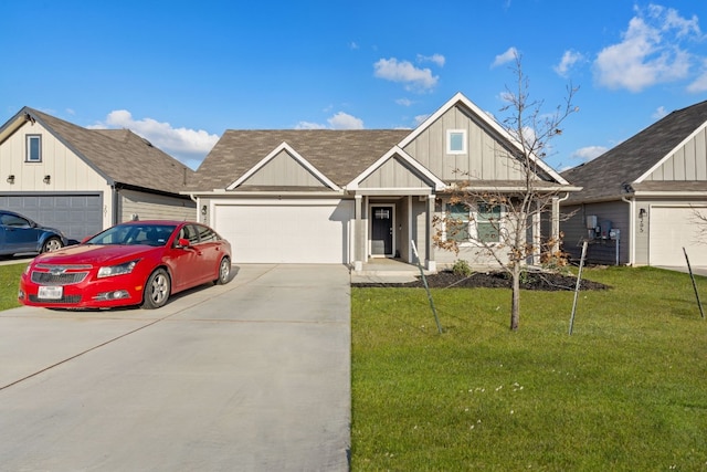 view of front of house featuring a garage and a front yard