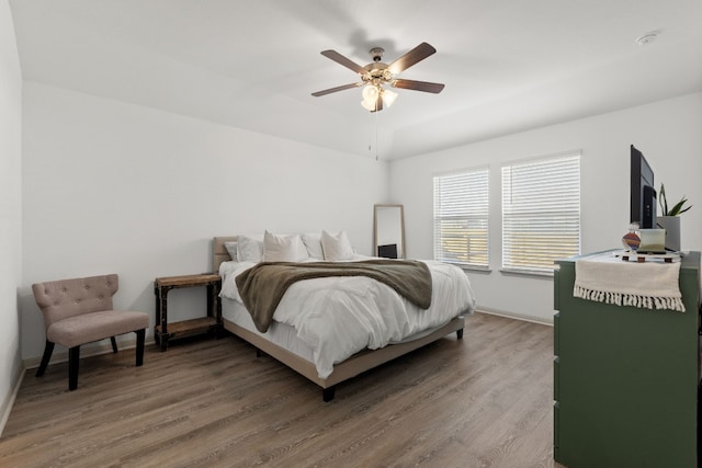 bedroom featuring wood-type flooring and ceiling fan