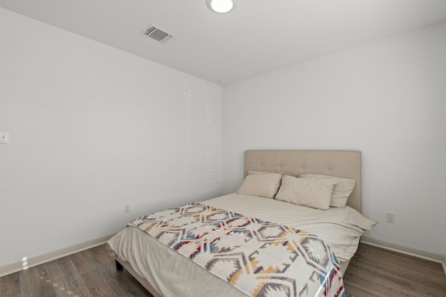 bedroom featuring dark hardwood / wood-style floors