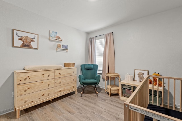 sitting room featuring hardwood / wood-style floors