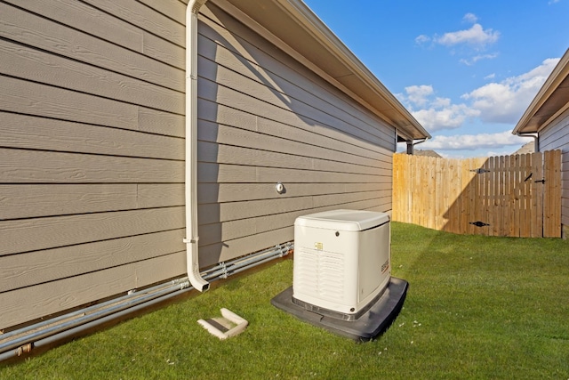 view of side of home featuring a lawn