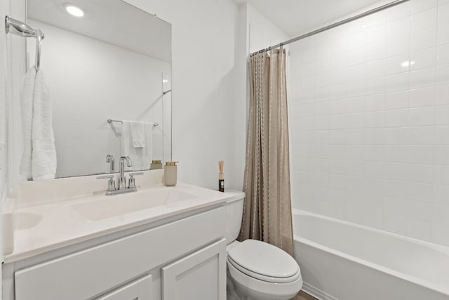 full bathroom featuring vanity, shower / tub combo with curtain, and toilet