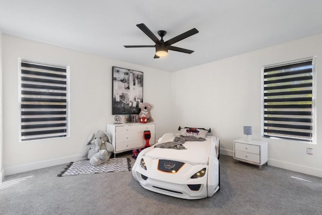 carpeted bedroom with ceiling fan