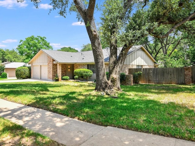 view of front of home featuring a garage and a front lawn